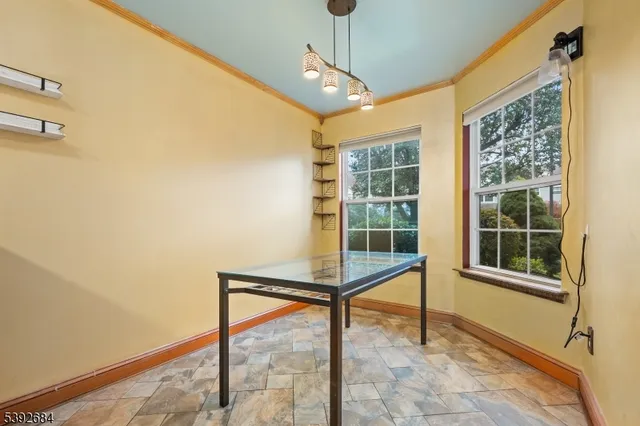 a view of a room with a large window