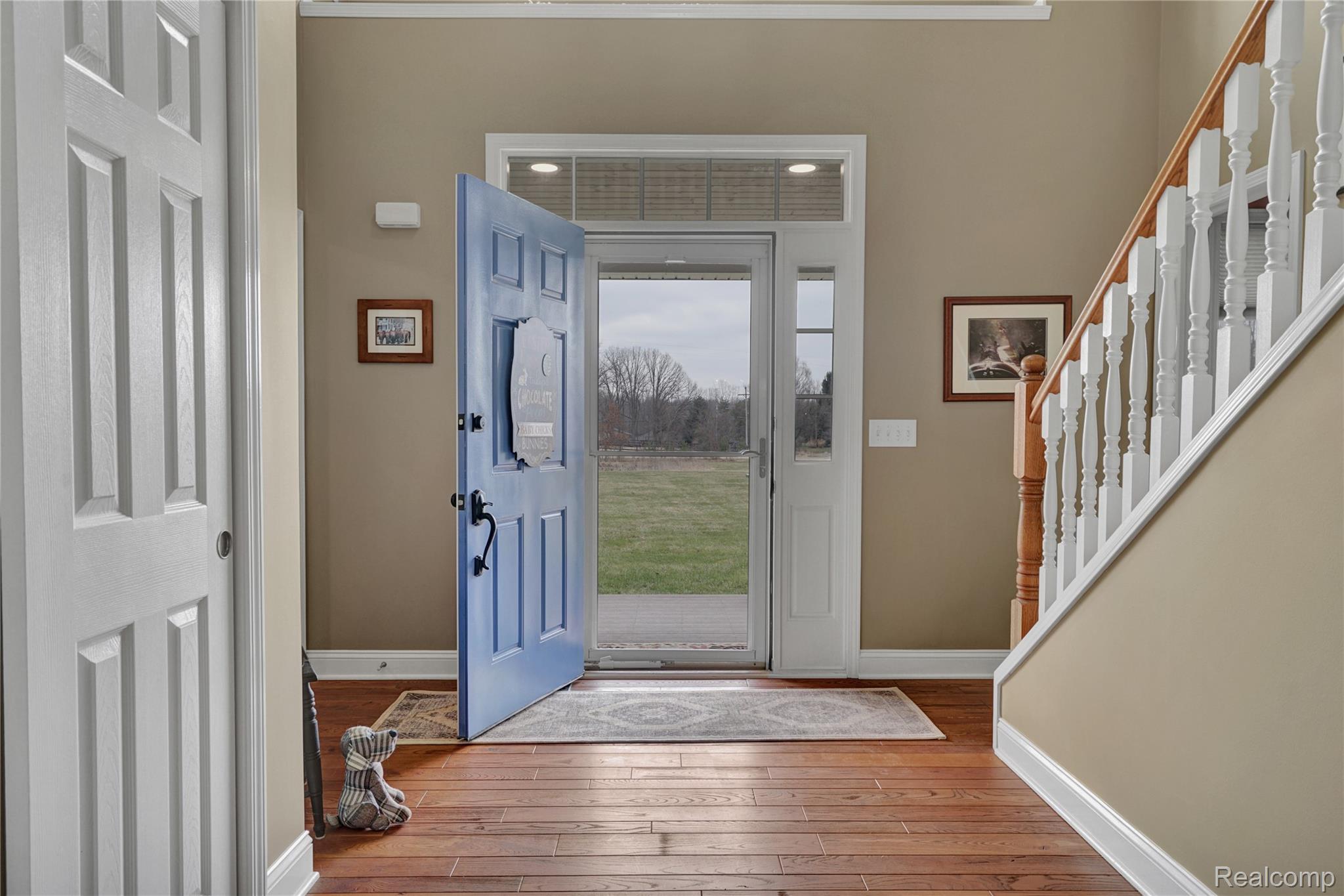 3690 Brauer Road Oxford, MI 48371 - Photo 8 of 63 Entryway featuring stairs and light wood-type flooring