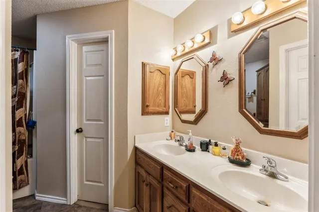 a bedroom with furniture and a book shelf