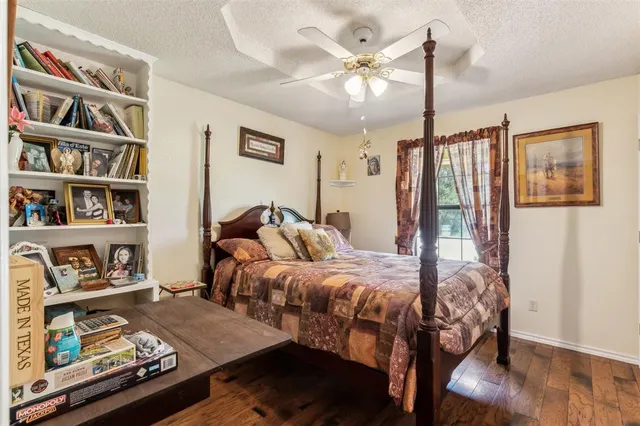 a bathroom with a sink a toilet and shower curtain