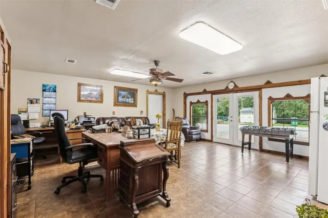 a living room with furniture or couch and a potted plant