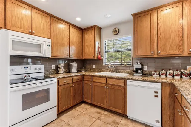 a dining room with furniture and chandelier fan