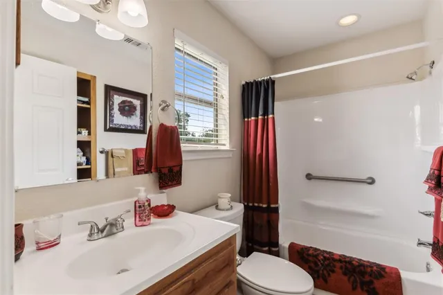 a front view of a house with a yard table and chairs