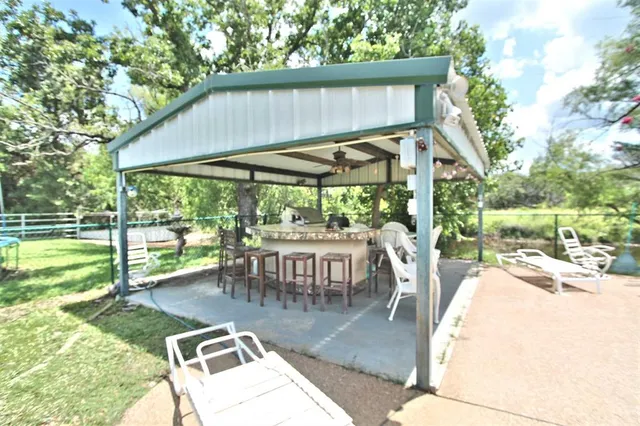 a view of a backyard of the house