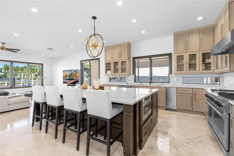 a kitchen with stainless steel appliances granite countertop a stove and a sink