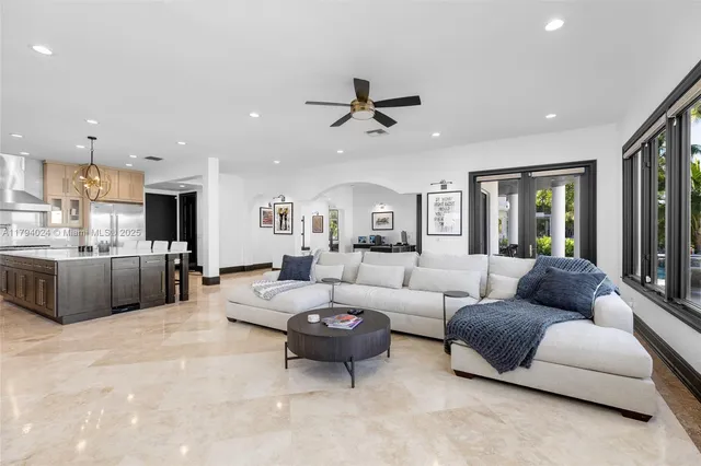a spacious bathroom with a tub sink and mirror