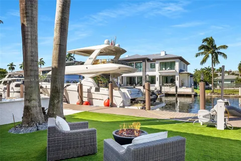 a view of a chairs and table in the patio