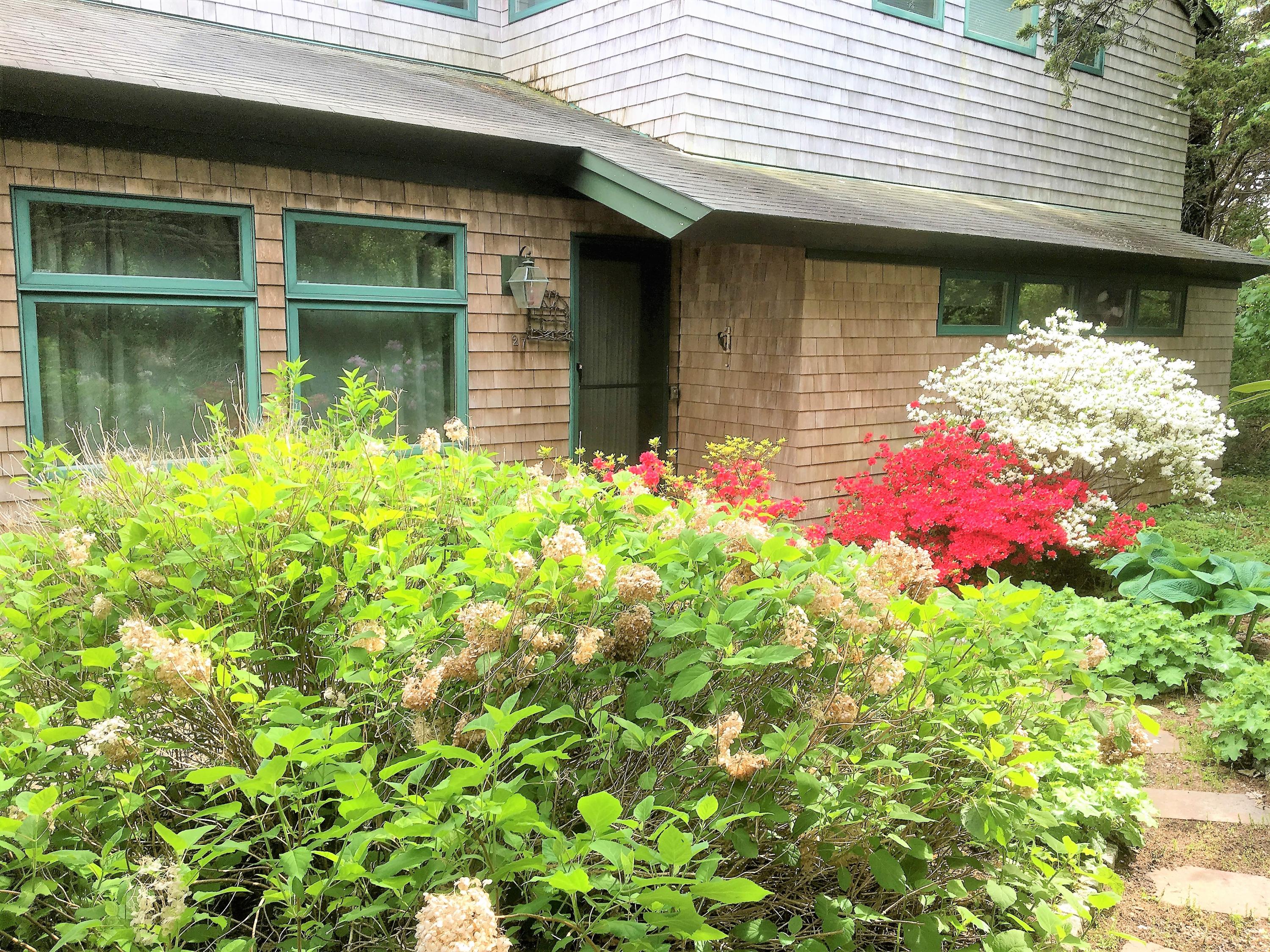 27 Briar Spring Road Orleans, MA 02653 - Photo 1 of 32 a front view of a house with a yard
