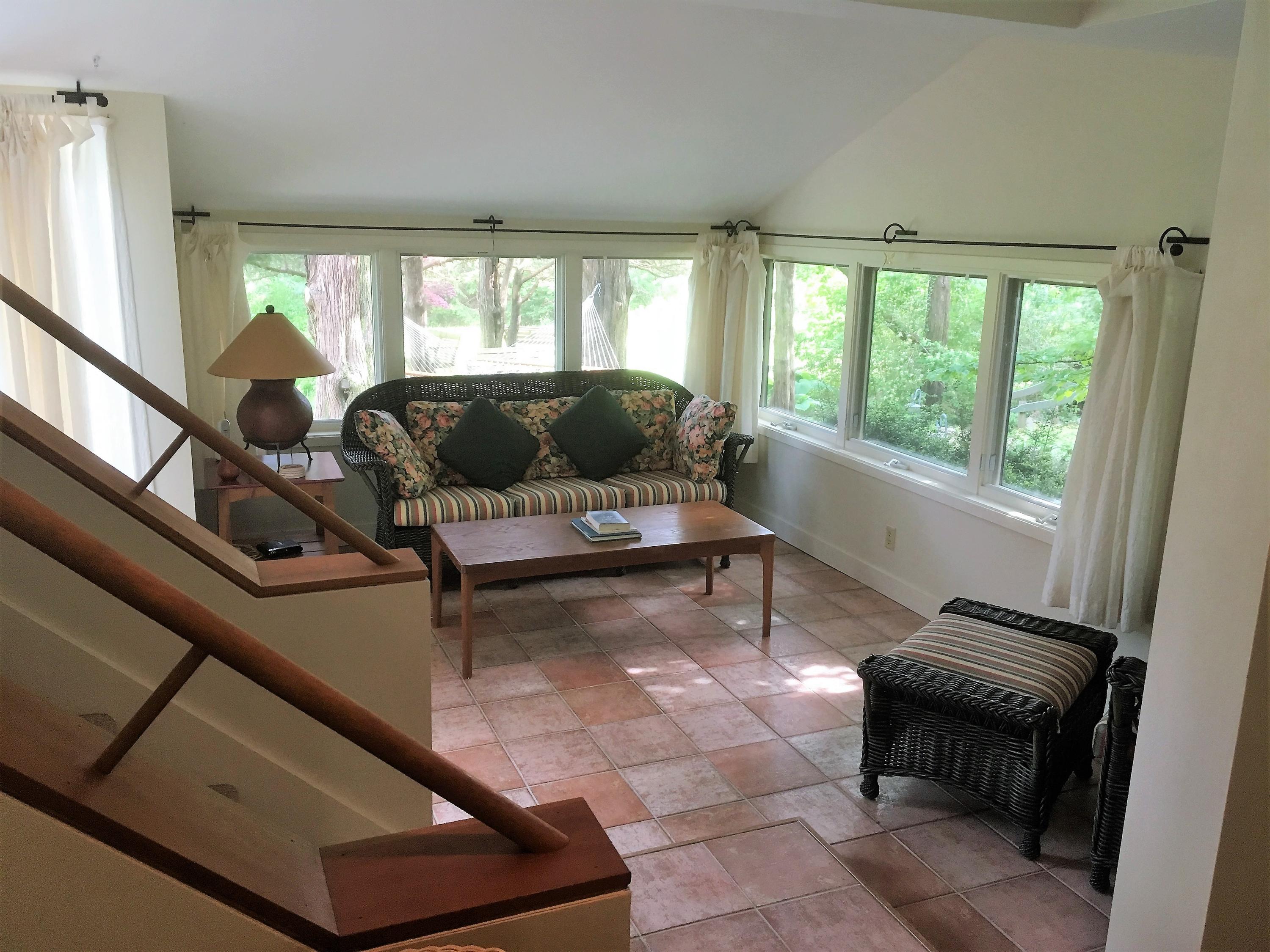 27 Briar Spring Road Orleans, MA 02653 - Photo 13 of 32 a living room with furniture and a potted plant