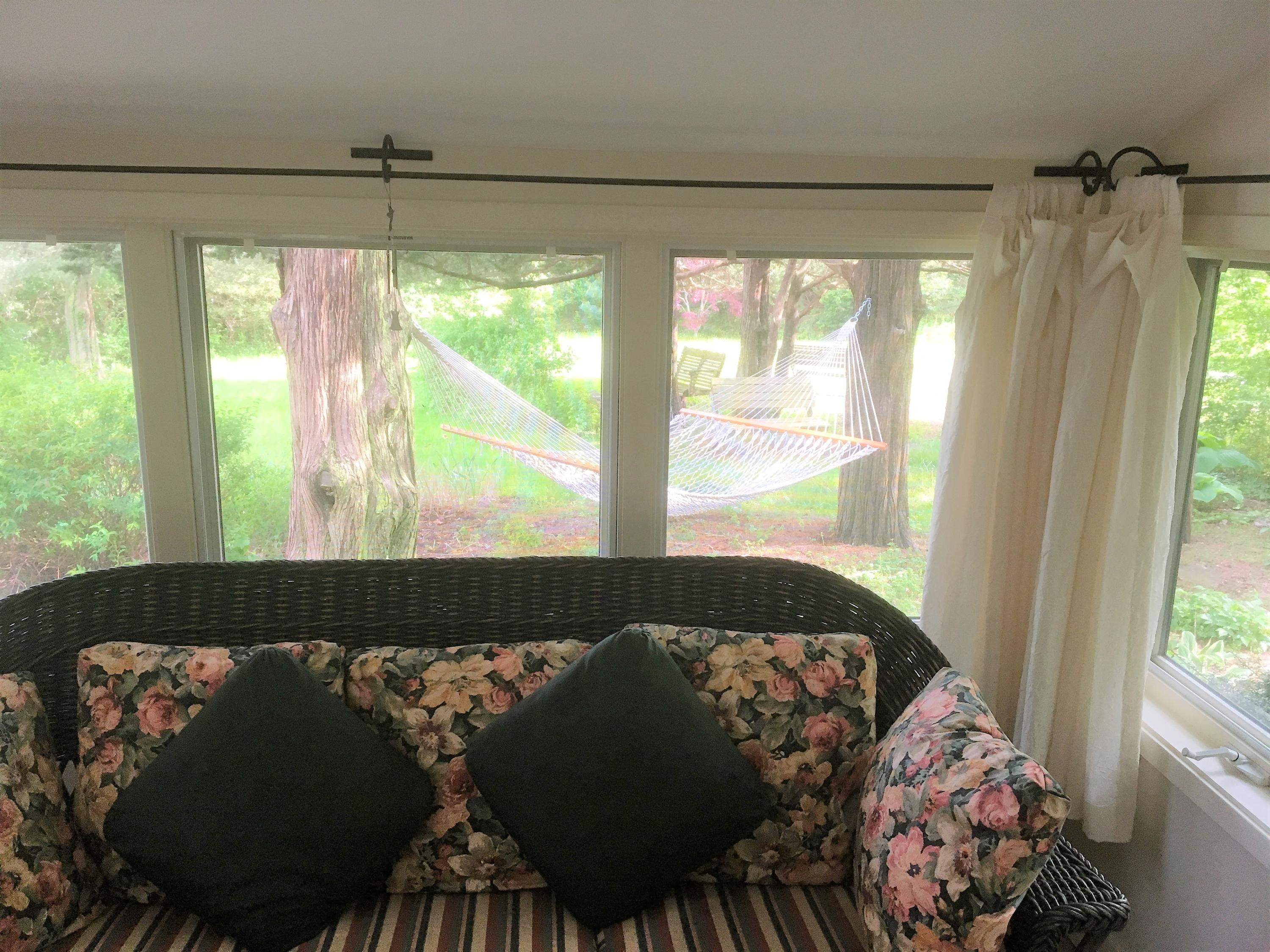 27 Briar Spring Road Orleans, MA 02653 - Photo 14 of 32 a bed sitting in a bedroom next to a window