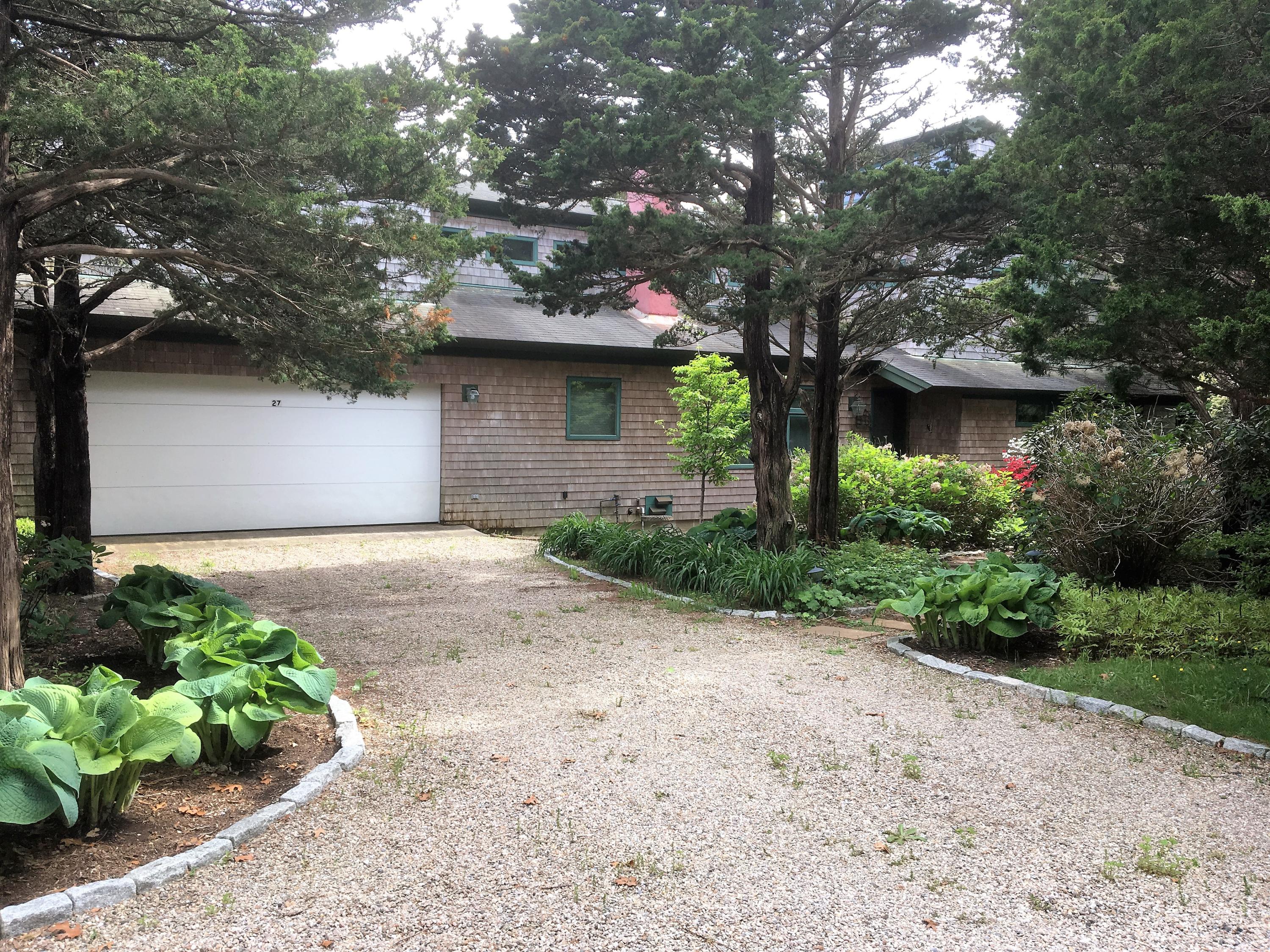 27 Briar Spring Road Orleans, MA 02653 - Photo 2 of 32 a front view of a house with garden