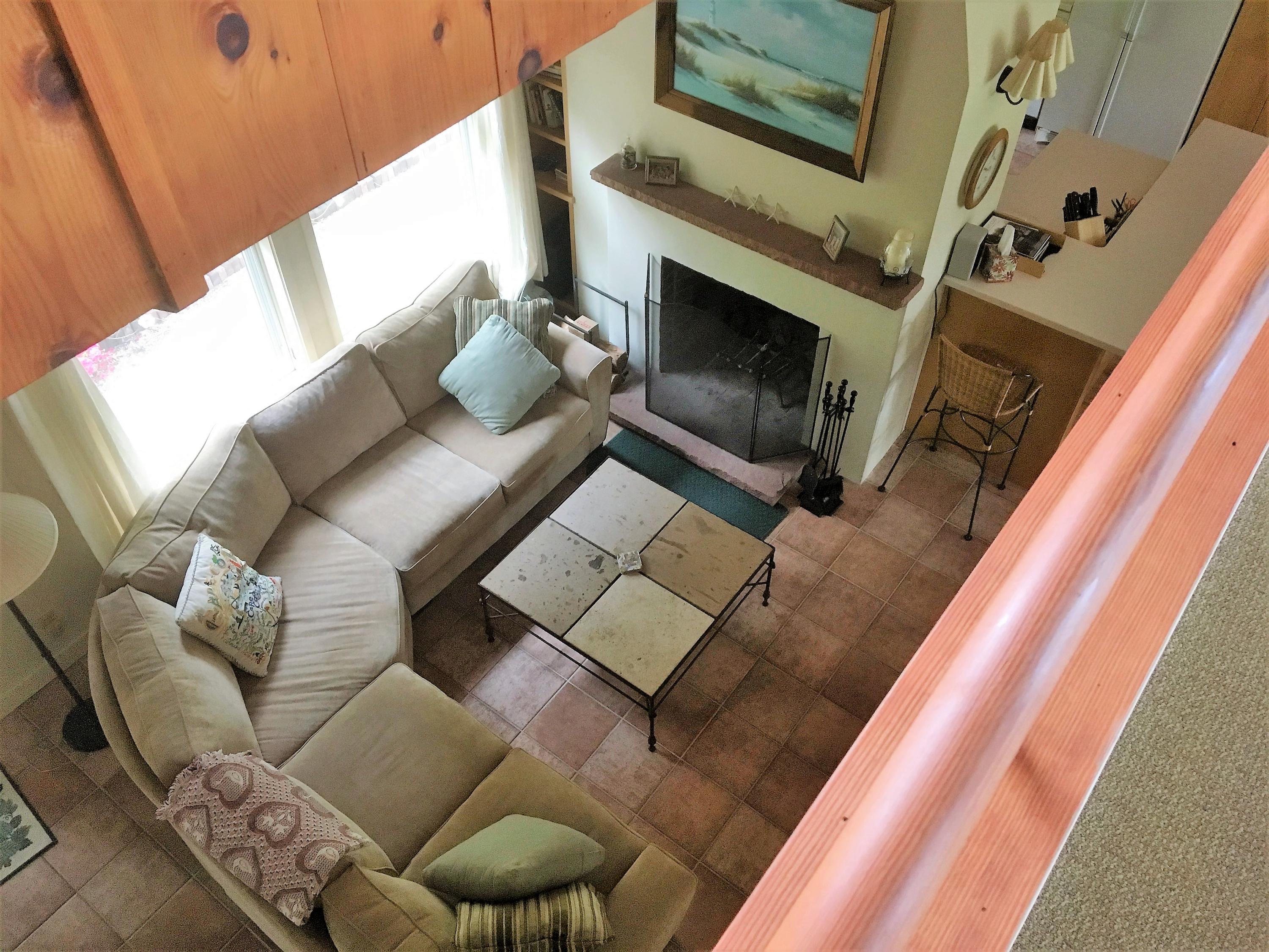 27 Briar Spring Road Orleans, MA 02653 - Photo 23 of 32 a living room with furniture and a fireplace