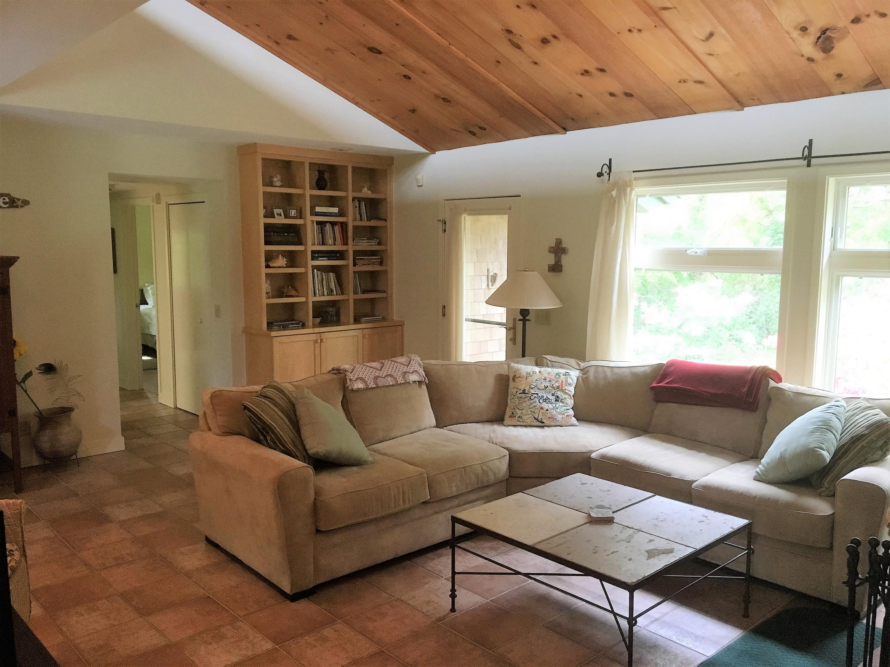 27 Briar Spring Road Orleans, MA 02653 - Photo 6 of 32 a living room with furniture and a large window