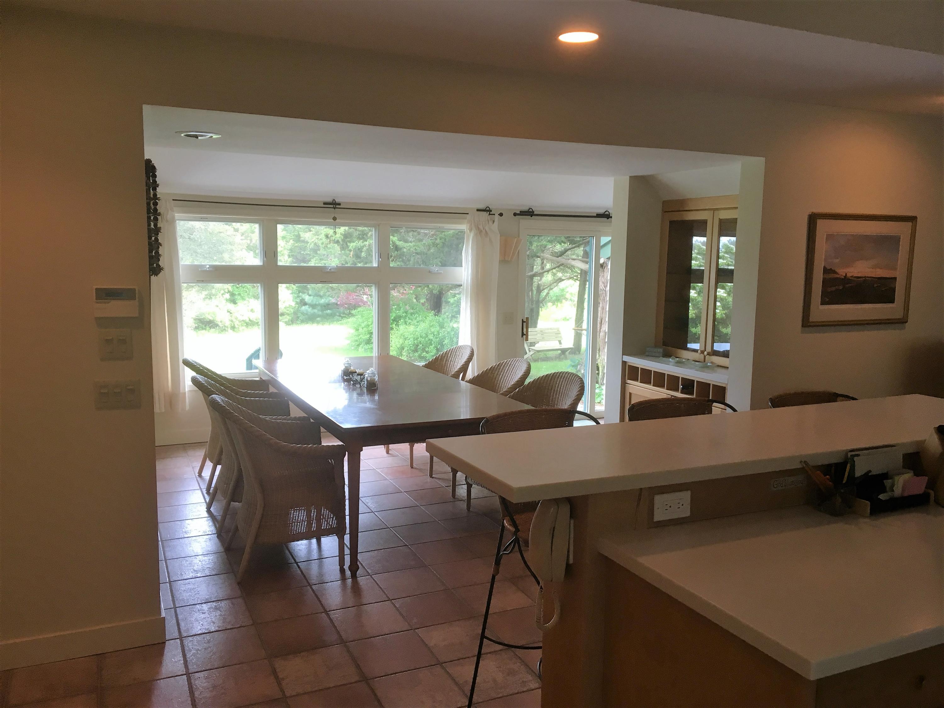 27 Briar Spring Road Orleans, MA 02653 - Photo 9 of 32 a view of a dining room with furniture and window
