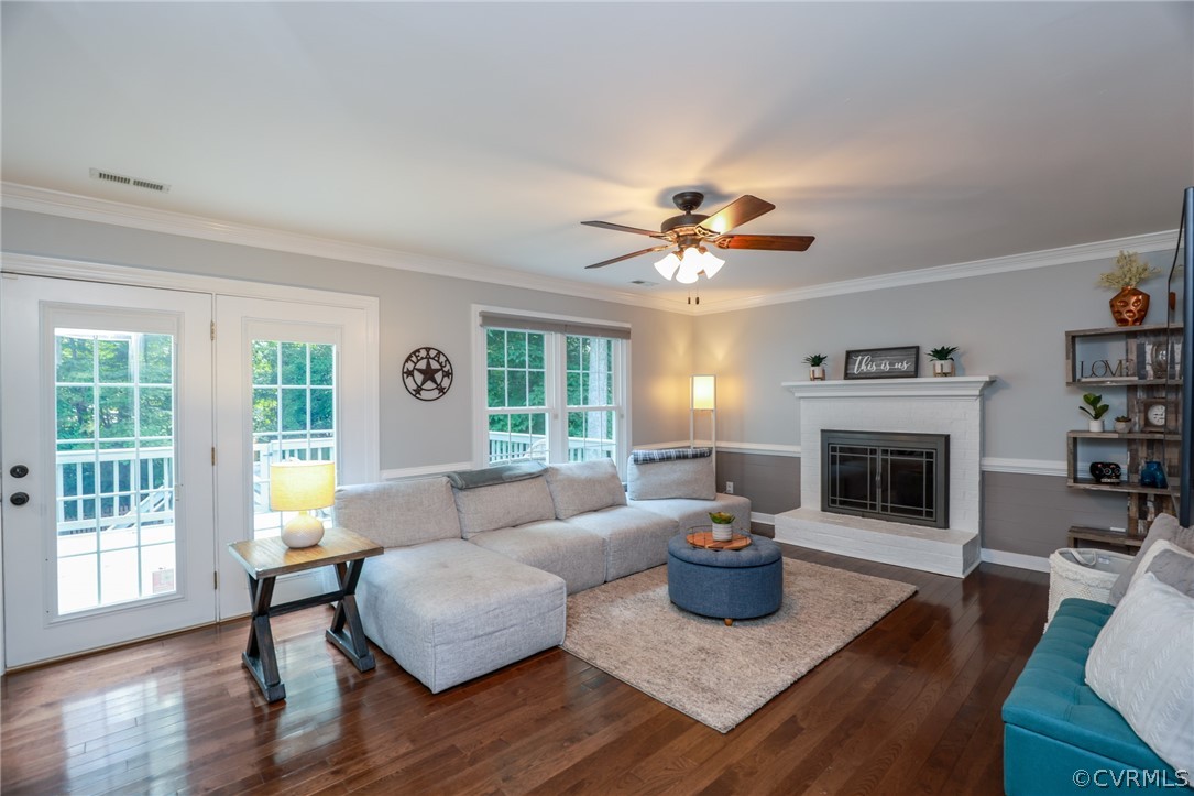 5219 Rock Harbour Road Midlothian, VA 23112 - Photo 11 of 50 a living room with furniture and a fireplace