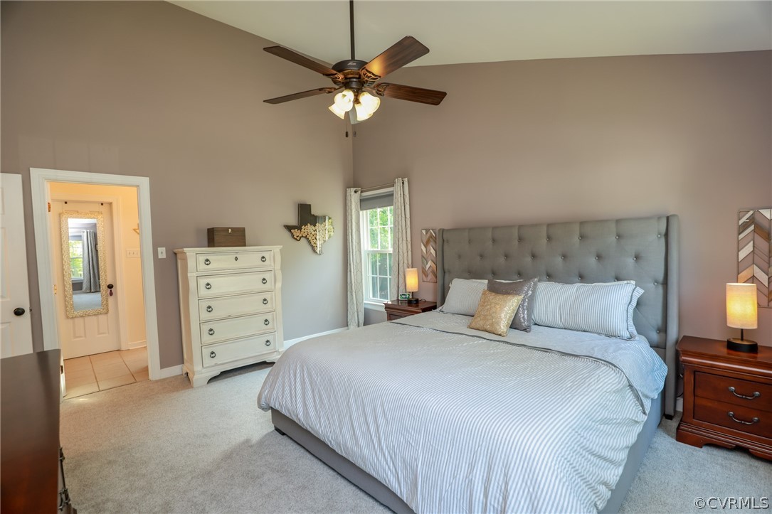 5219 Rock Harbour Road Midlothian, VA 23112 - Photo 23 of 50 a bedroom with a bed and a chandelier