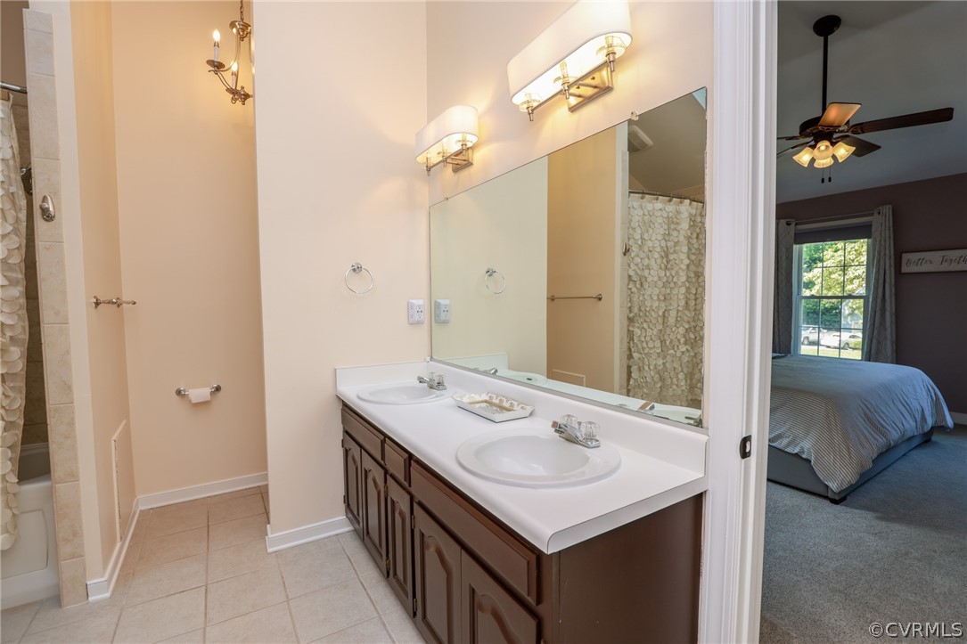 5219 Rock Harbour Road Midlothian, VA 23112 - Photo 24 of 50 a bathroom with a sink vanity and a mirror