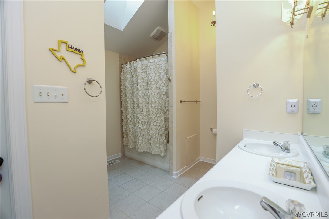 5219 Rock Harbour Road Midlothian, VA 23112 - Photo 25 of 50 a bathroom with a sink and a shower