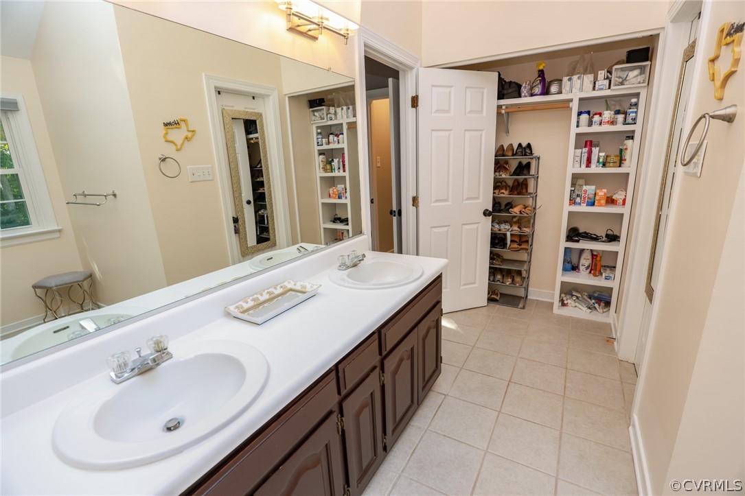 5219 Rock Harbour Road Midlothian, VA 23112 - Photo 27 of 50 a bathroom with a sink and a mirror