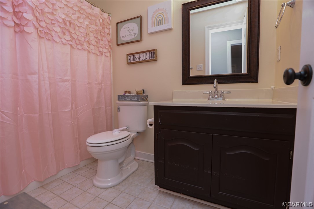 5219 Rock Harbour Road Midlothian, VA 23112 - Photo 30 of 50 a bathroom with a toilet sink and mirror