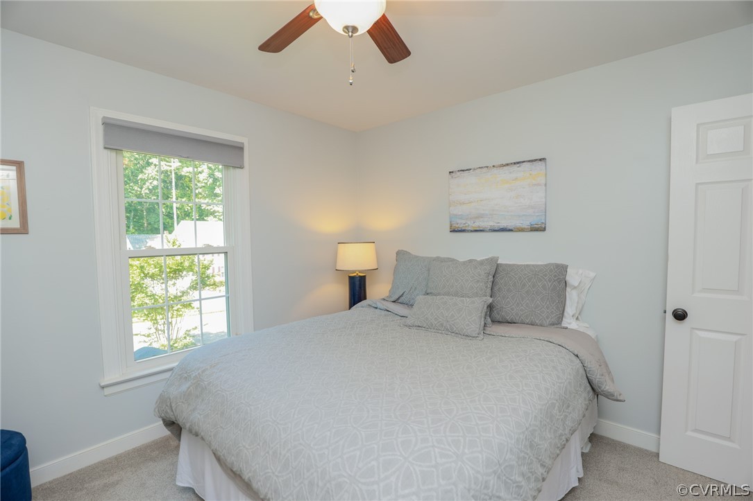 5219 Rock Harbour Road Midlothian, VA 23112 - Photo 32 of 50 a bedroom with a bed and a window