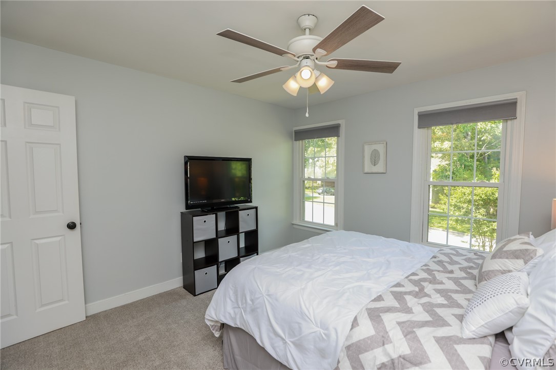 5219 Rock Harbour Road Midlothian, VA 23112 - Photo 34 of 50 a bedroom with a bed and a flat screen tv