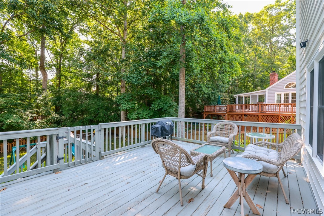 5219 Rock Harbour Road Midlothian, VA 23112 - Photo 37 of 50 a view of balcony with furniture and trees