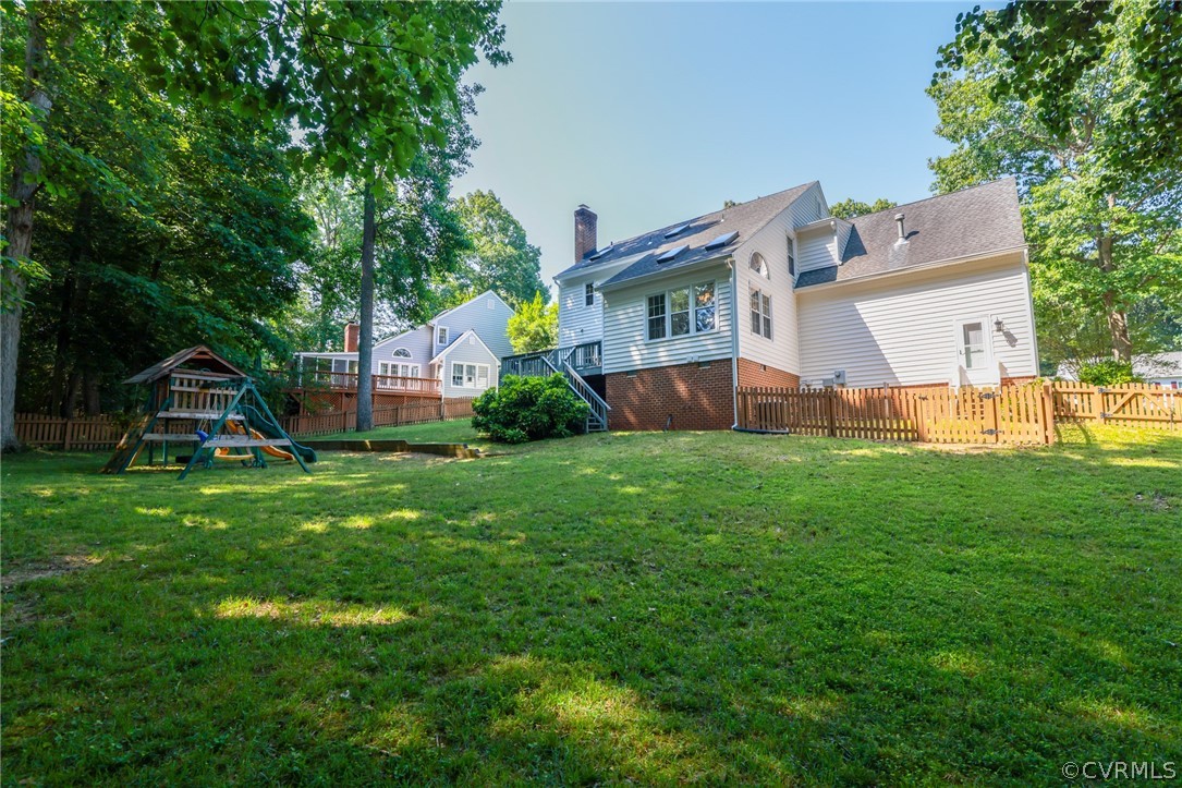 5219 Rock Harbour Road Midlothian, VA 23112 - Photo 38 of 50 a view of a house with a backyard