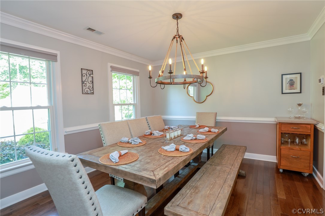 5219 Rock Harbour Road Midlothian, VA 23112 - Photo 6 of 50 a view of a dining room with furniture wooden floor and chandelier