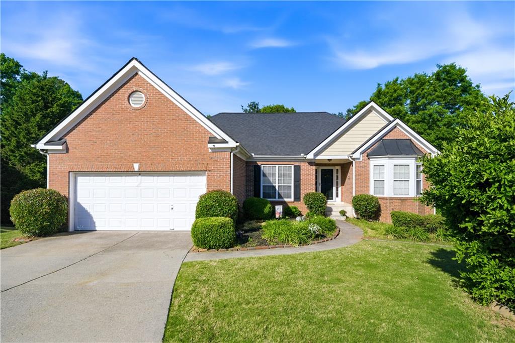 3324 Dunbar Lane Suwanee, GA 30024 - Photo 2 of 42 a view of a house with yard and plants