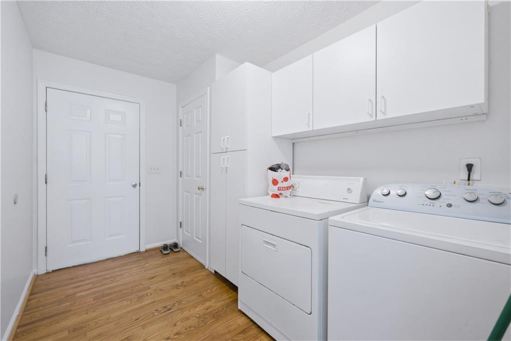 3324 Dunbar Lane Suwanee, GA 30024 - Photo 24 of 42 a view of storage and utility room with washer and dryer