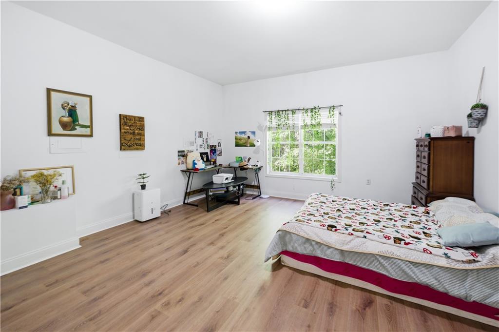 3324 Dunbar Lane Suwanee, GA 30024 - Photo 26 of 42 a bedroom with a bed and a window