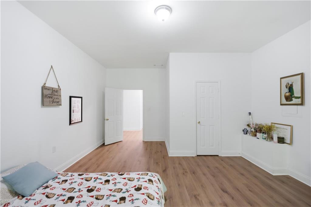 3324 Dunbar Lane Suwanee, GA 30024 - Photo 27 of 42 a bedroom with a bed and a window