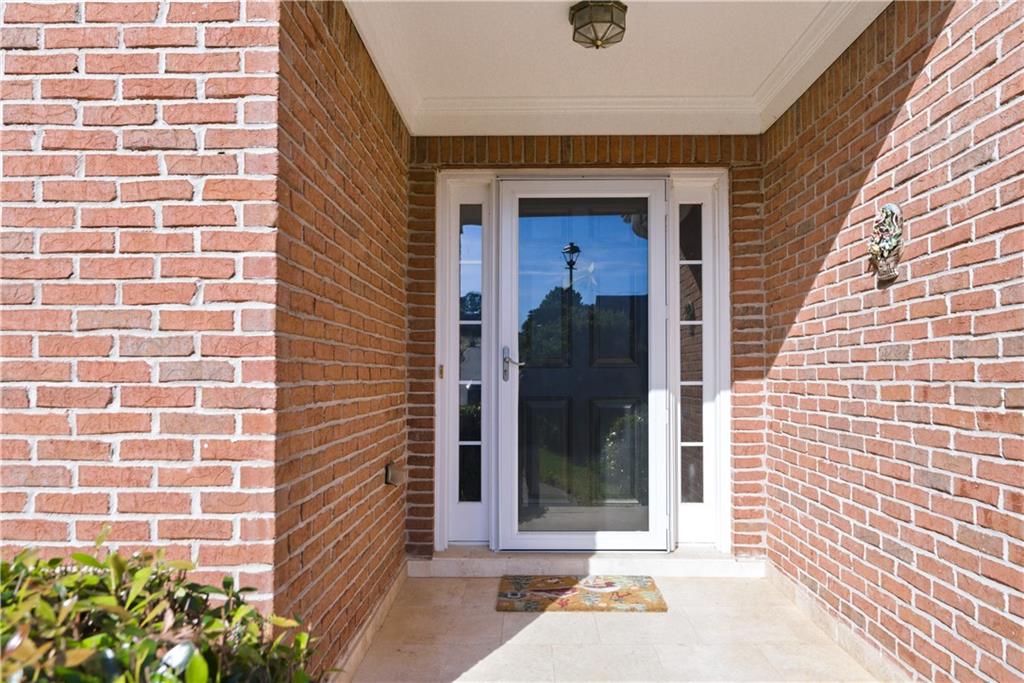 3324 Dunbar Lane Suwanee, GA 30024 - Photo 3 of 42 a view of a door and brick windows