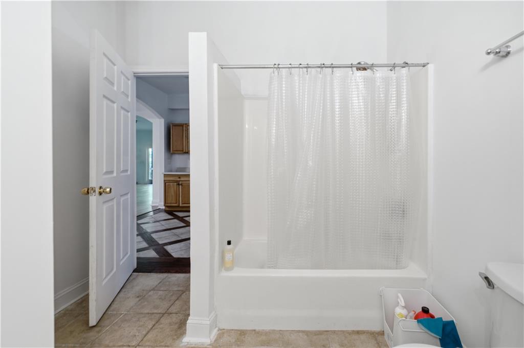 3324 Dunbar Lane Suwanee, GA 30024 - Photo 34 of 42 a bathroom with a bathtub and shower