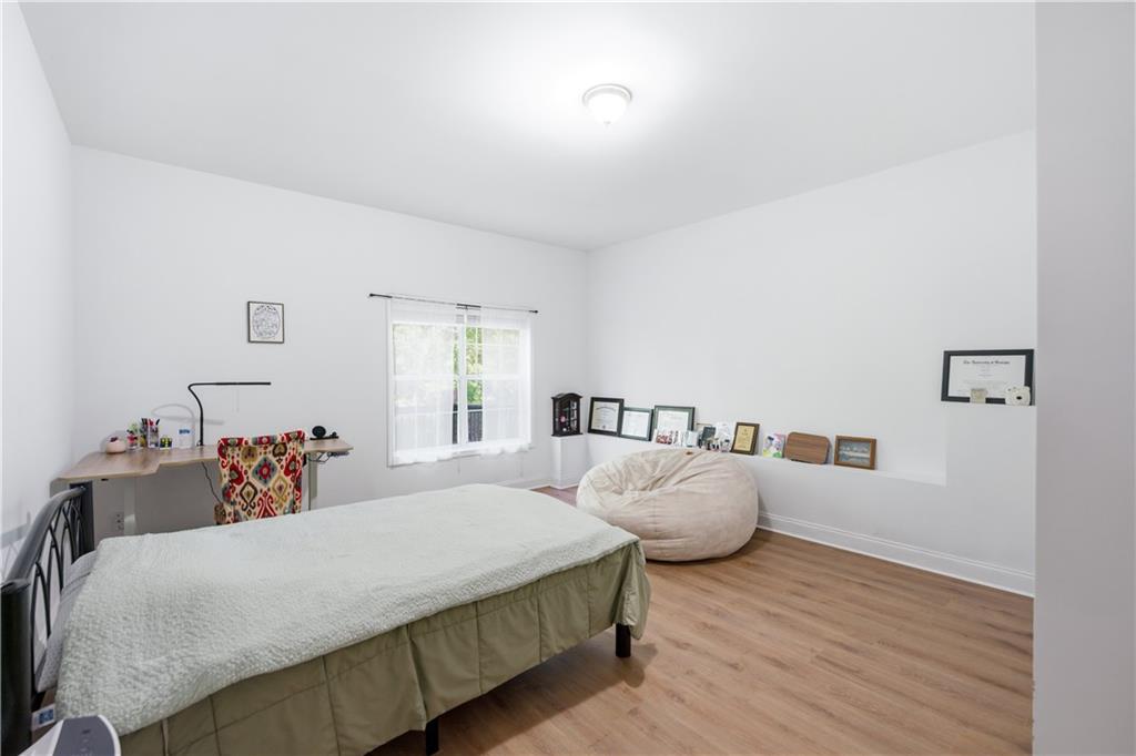 3324 Dunbar Lane Suwanee, GA 30024 - Photo 35 of 42 a bedroom with bed and window