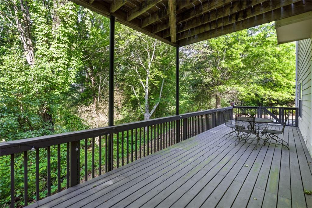 3324 Dunbar Lane Suwanee, GA 30024 - Photo 38 of 42 a view of balcony with chairs and wooden fence