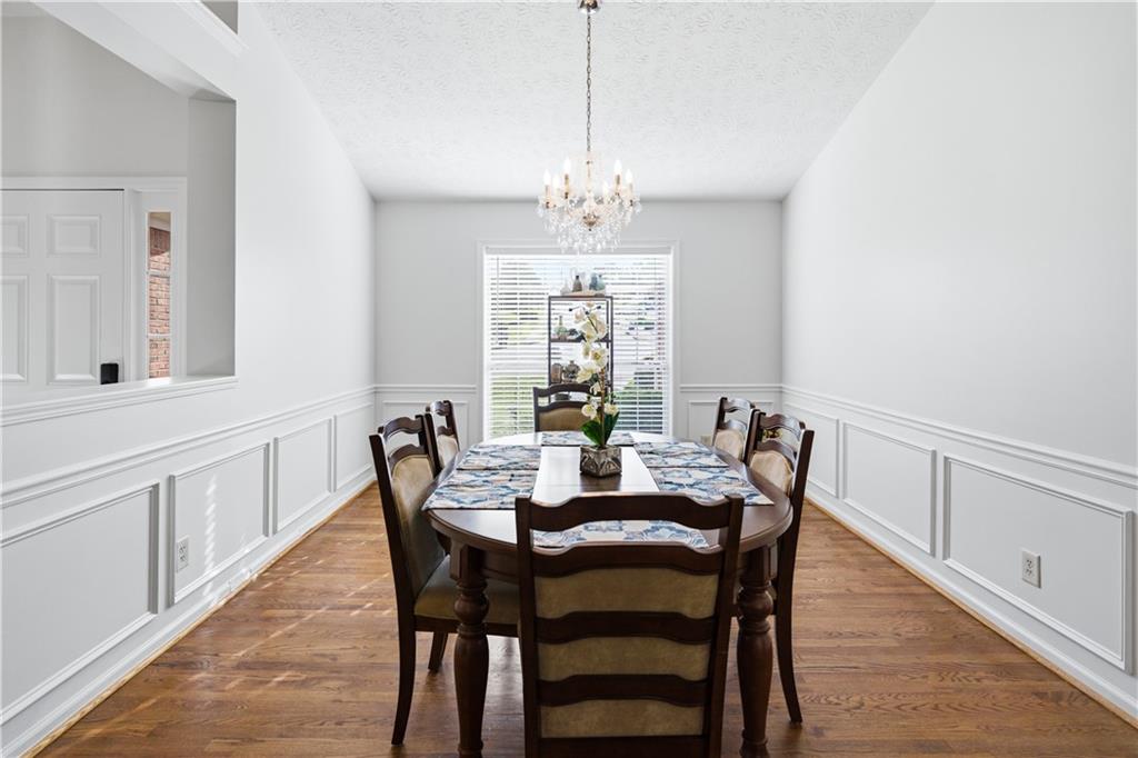 3324 Dunbar Lane Suwanee, GA 30024 - Photo 5 of 42 a view of a dining room with furniture window and wooden floor