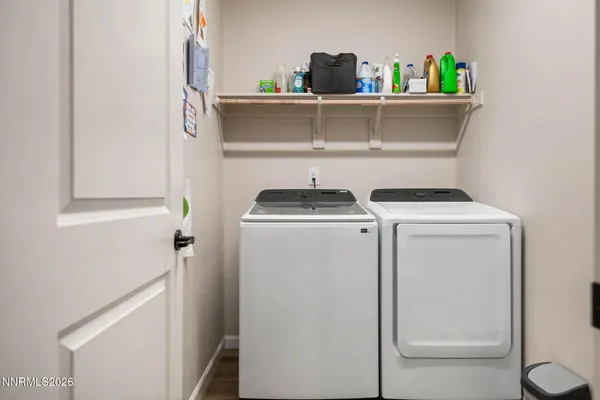 a view of a patio with table and chairs and potted plants