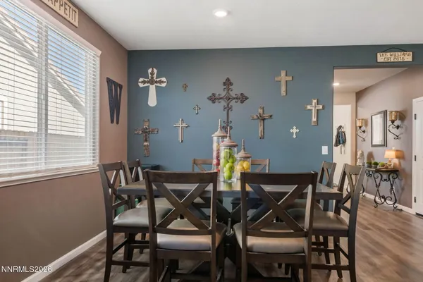 a view of a dining room with furniture and wooden floor