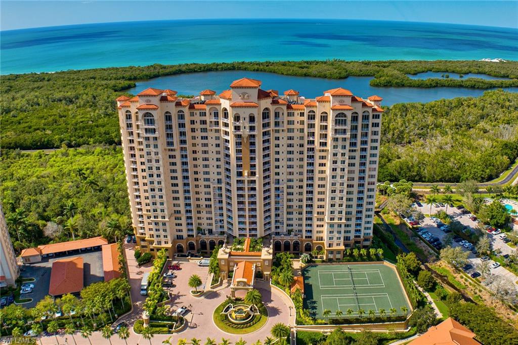 6597 Nicholas Boulevard, Unit 401 Naples, FL 34108 - Photo 20 of 28 a view of a city with an ocean view