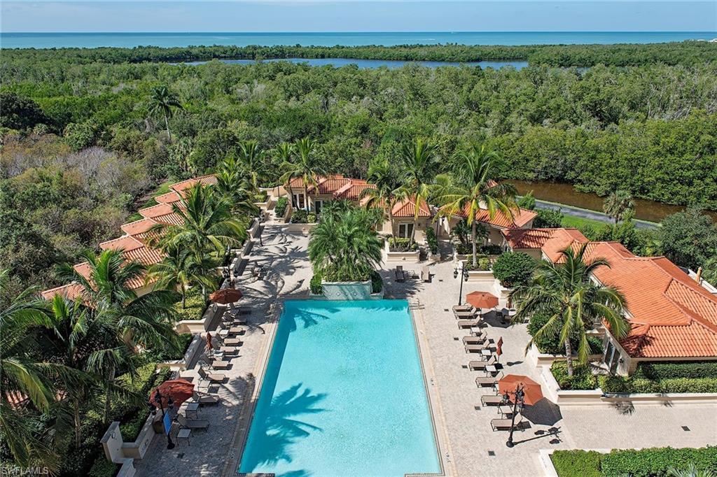 6597 Nicholas Boulevard, Unit 401 Naples, FL 34108 - Photo 23 of 28 an aerial view of a yard with a lake view