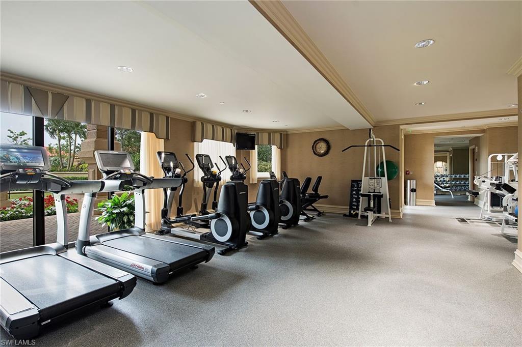 6597 Nicholas Boulevard, Unit 401 Naples, FL 34108 - Photo 24 of 28 a view of a room with gym equipment