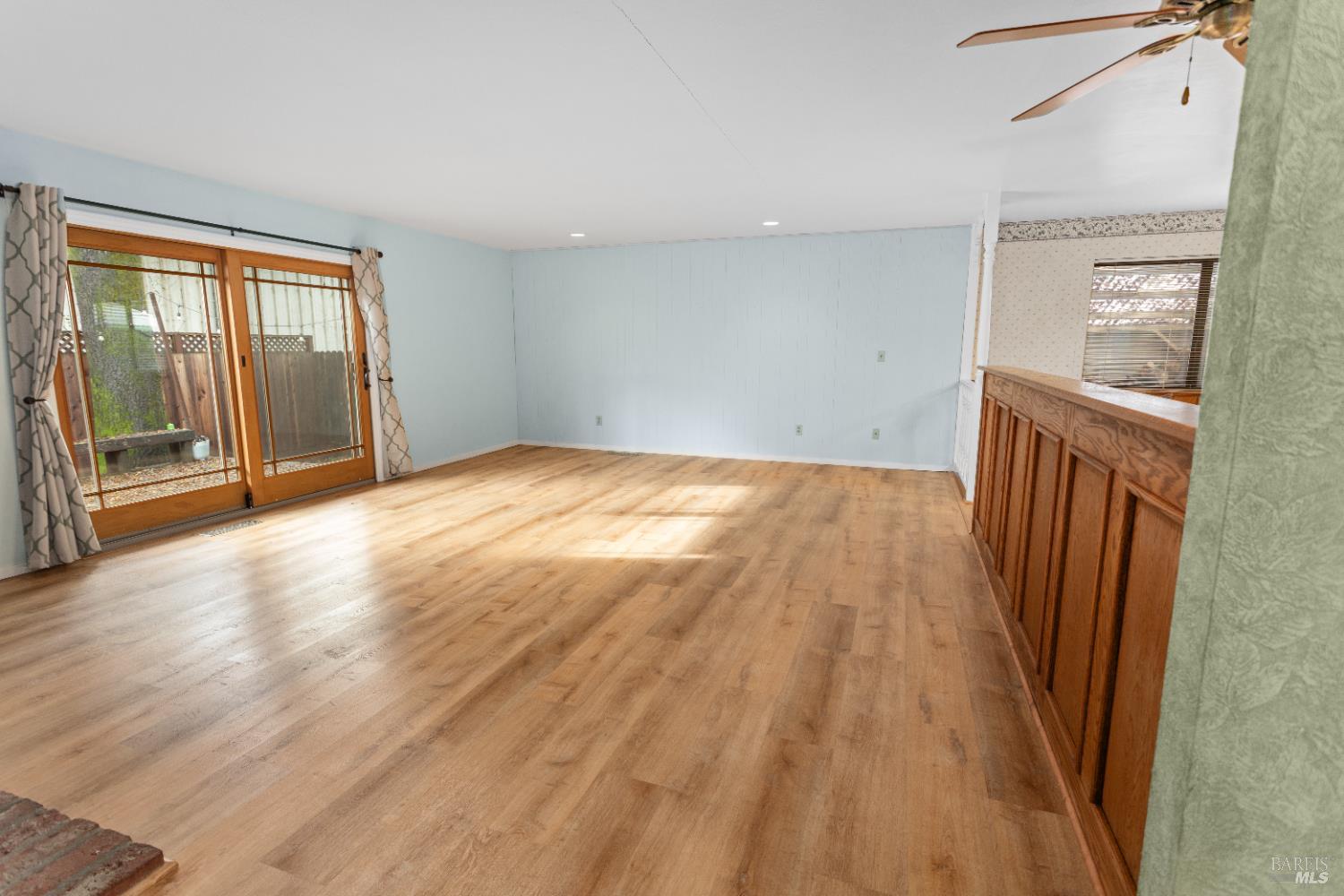 424 B Mason Street Healdsburg, CA 95448 - Photo 13 of 27 wooden floor in an empty room with a window