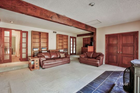 548 East Laura Avenue Ridgecrest, CA 93555 - Photo 16 of 34 a living room with furniture and large windows
