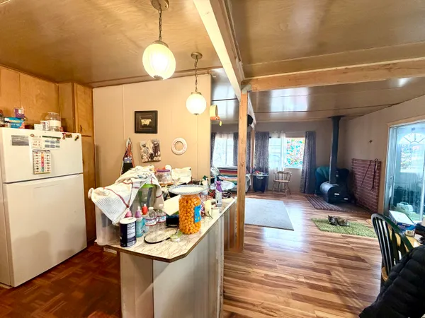 a bedroom with 2 bed and a window