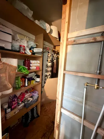 a bathroom with a toilet a sink and a mirror