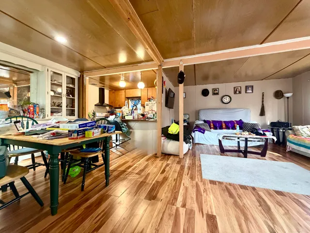 a kitchen with a refrigerator and a stove