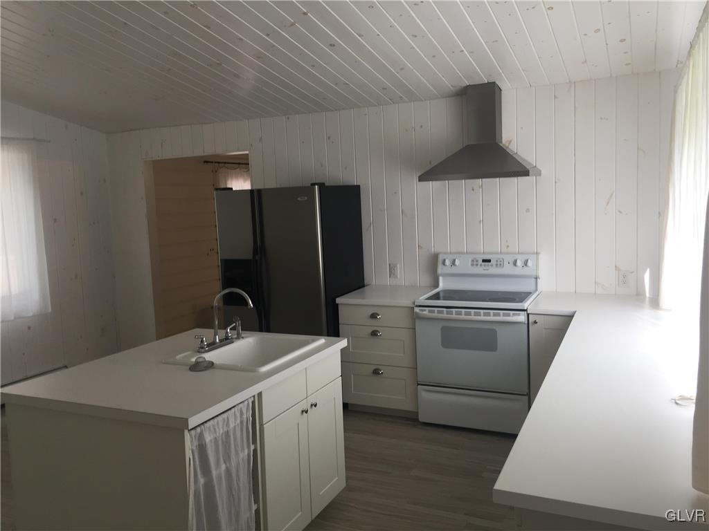 1710 Johns Road Effort, PA 18330 - Photo 3 of 27 a kitchen with a sink a stove and refrigerator