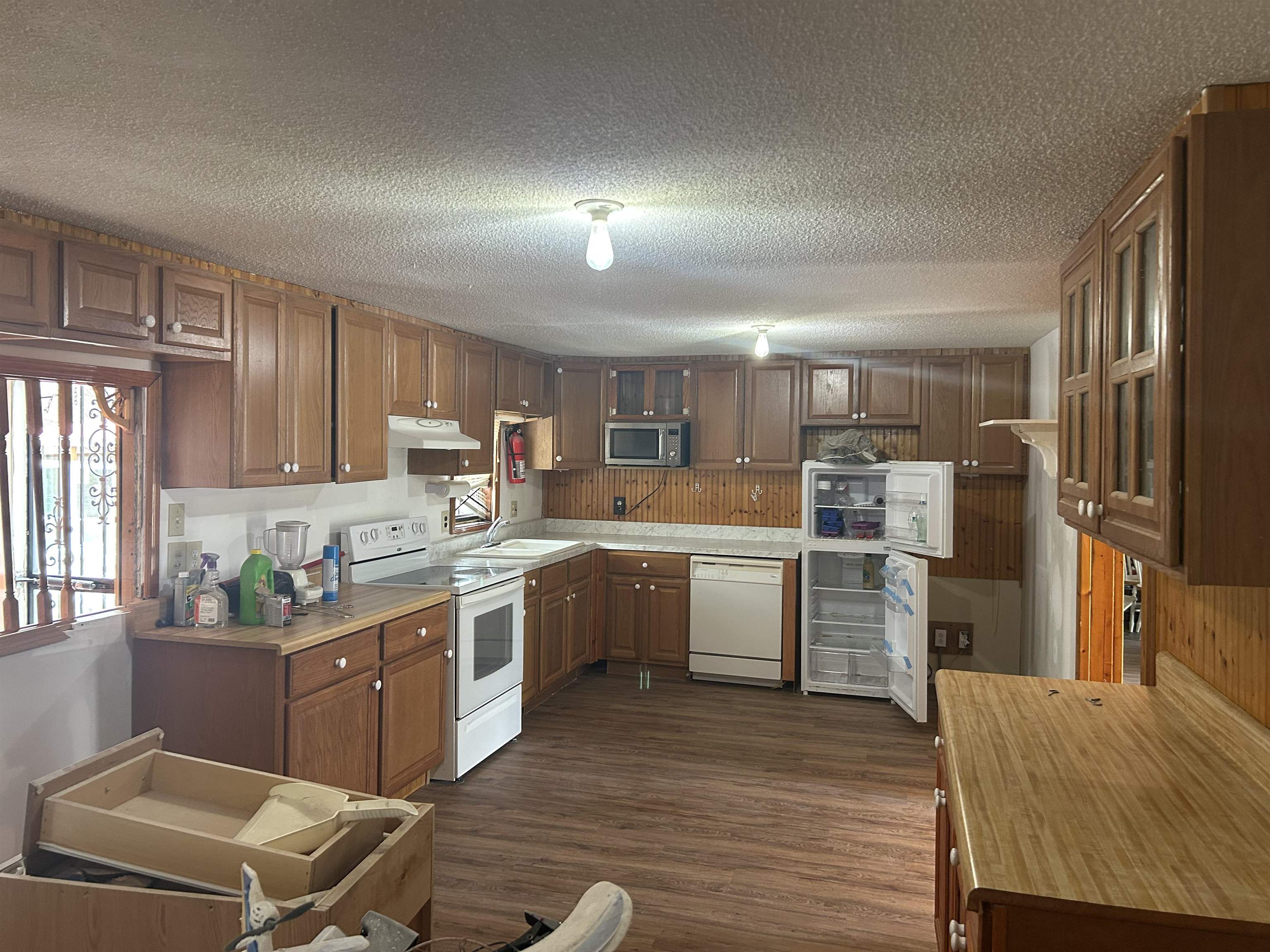328 Ridgemont Drive Jackson, TN 38305 - Photo 3 of 12 a kitchen with a sink refrigerator and microwave